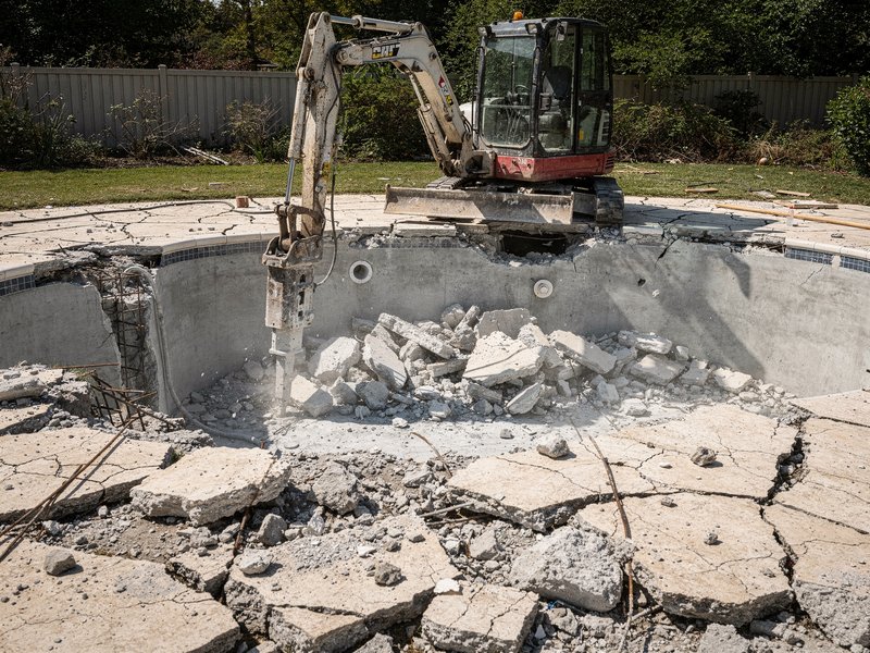 Swimming pool being demolished and removed in Houston, TX